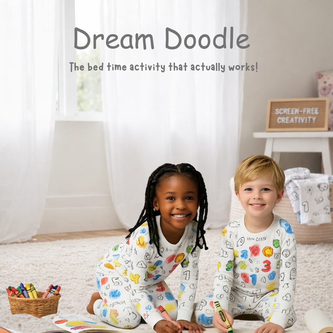 Two children in DreamDoodle colour-in pyjamas with crayons