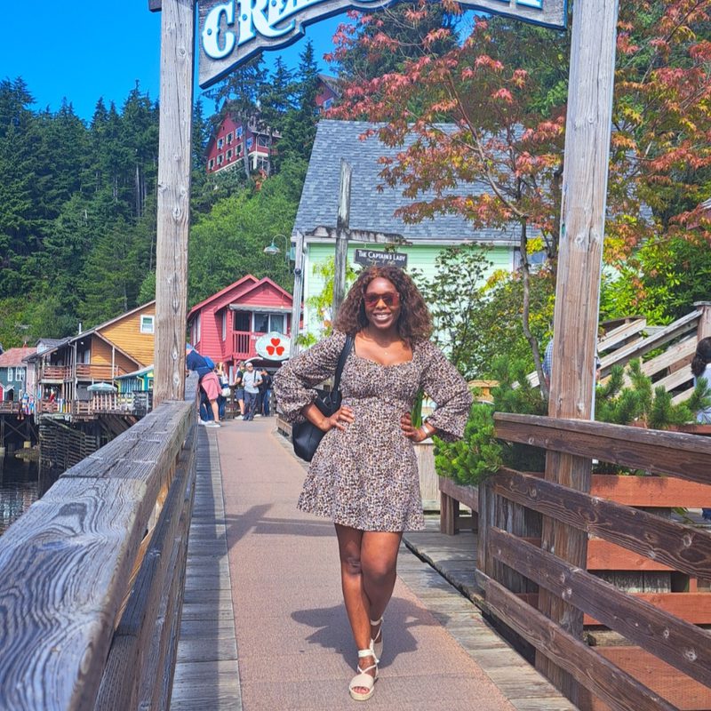 Hayley Molefe on a boardwalk in an Alaskan port town