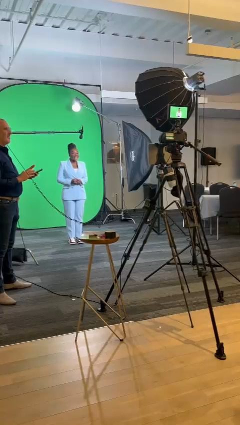 Hayley Molefe filming in front of a green screen studio setup
