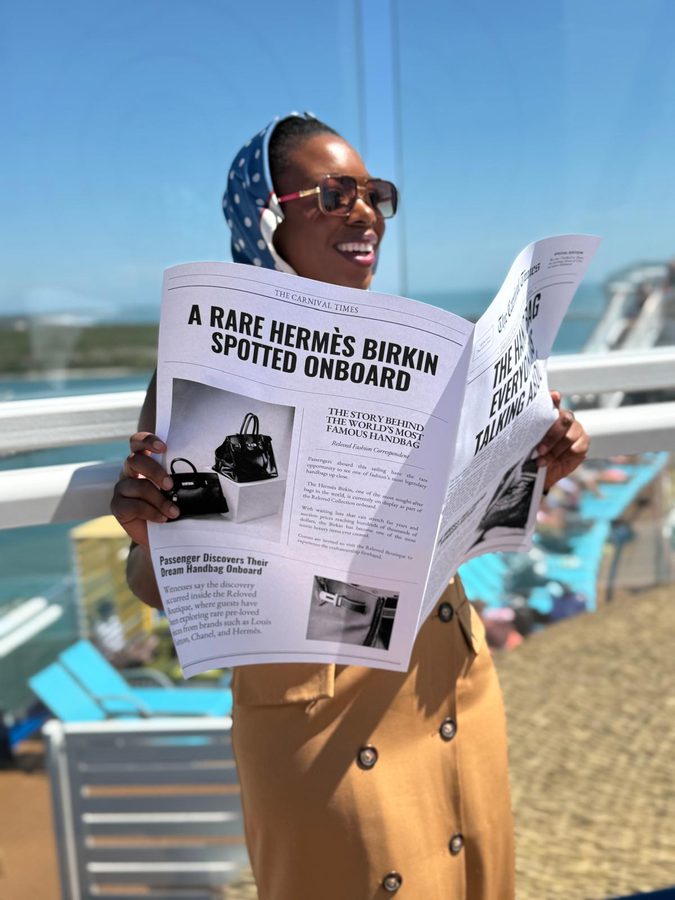 Hayley Molefe reading an onboard shopping newspaper